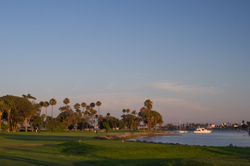 Naklejka na ściany i meble Afternoon setting sun over a beautiful Southern California golf course