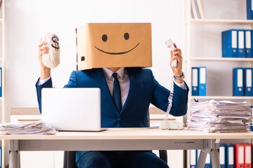 Happy man employee with box instead of his head