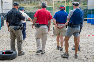 armed men on the shooter range