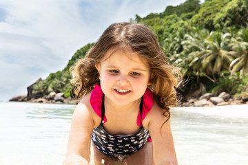 Smiling Cute Girl Playing In The Sea