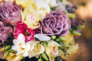 bouquet of flowers with roses, peonies, carnations. delicate bouquet in pink colors. eucalyptus leaves.