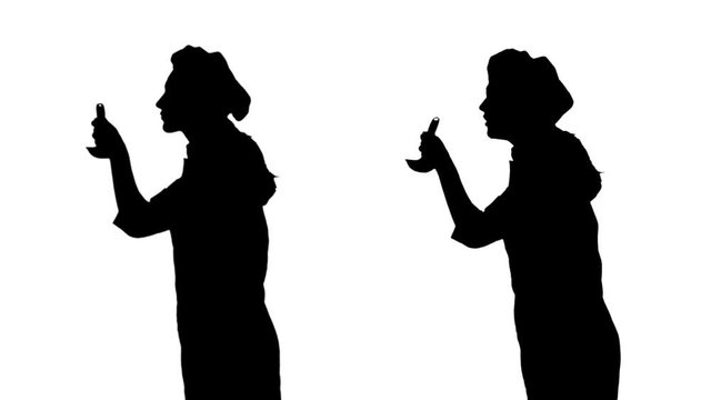 Two black silhouettes of cook girl trying dish of ladle.