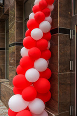 Making the entrance with colorful balloons during the celebration of a solemn event. Party or birthday banner with colorful balloons