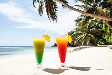 Colorful Cocktail Glasses On The Sandy Beach