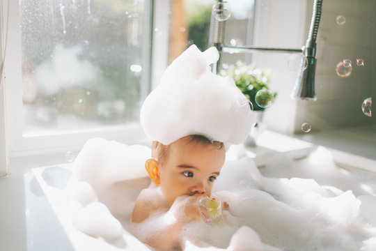 Baby Having A Bath In The Kitchen Sink