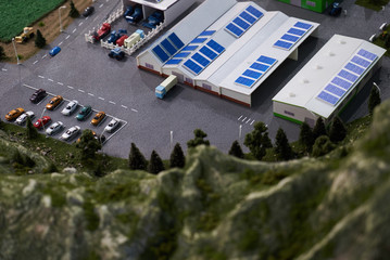 Aerial view of a grain terminal model with warehouses and cars parking