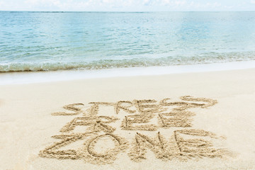 Stress Free Zone Written On Sand At Beach