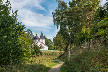 Fototapeta na wymiar The path to the Church of the Holy Trinity in the Bekhovo village, Russia, Polenovo