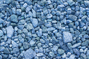 Abstract texture background copy space from freshly crushed blue crushed stone