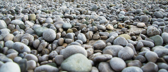 Textured background of stones, sea pebble on beach