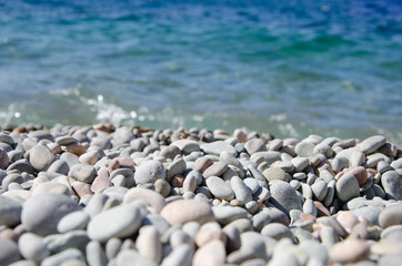 Seascape, view of pebble beach and clear turquoise  sea