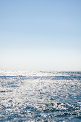 Seascape, view of sea horizon and blue sky