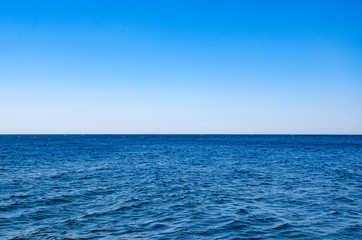 Seascape, view of sea horizon and blue sky