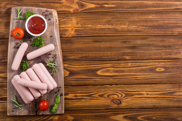 Raw beef sausages with pepper , herbs and ketchup
