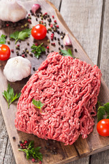 Raw minced beef meat with spices and herbs