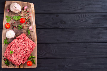 Raw minced beef meat with spices and herbs