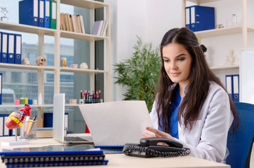 Female doctor cardiologist working in the clinic 