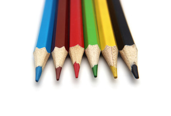Wooden colored pencils isolated on white background.