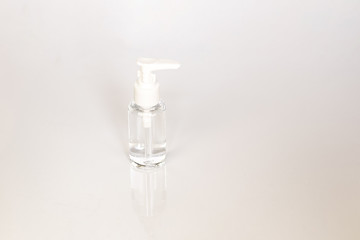 Beauty cosmetics glassbottle; branding mock up; front view on pastel white background. Package for essential oil.