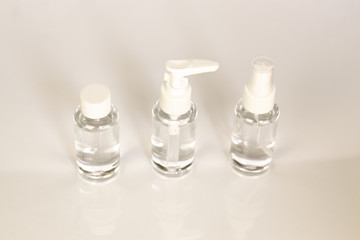 Beauty cosmetics glassbottle; branding mock up; front view on pastel white background. Package for essential oil.
