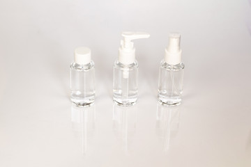 Beauty cosmetics glassbottle; branding mock up; front view on pastel white background. Package for essential oil.