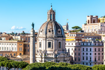 Fototapeta na wymiar Trajan's Column and Church of the Most Holy Name of Mary, Rome, Italy