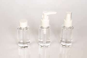 Beauty cosmetics glassbottle; branding mock up; front view on pastel white background. Package for essential oil.