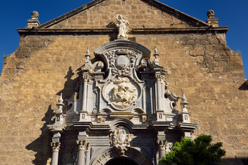Fototapeta premium Church of Saint Justus and Pastor with statue of Saint Ignatius in the University Plaza Granada