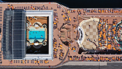Aerial drone photo of unidentified huge cruise ship liner with luxury pool facilities docked in port of Piraeus one of the largest in Europe, Attica, Greece