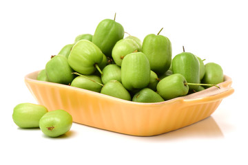 mini kiwi baby fruit (actinidia arguta) on white background 