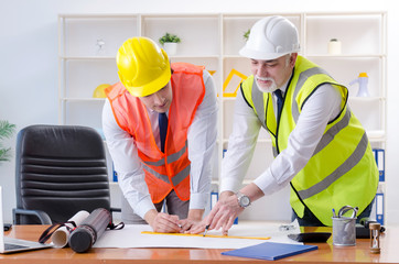 Two engineers colleagues working under project 