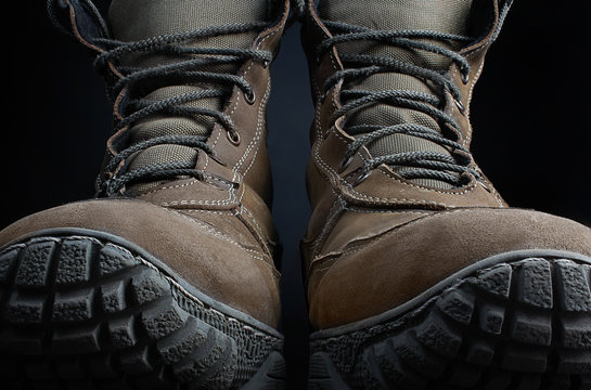 Photo of a pair of military boots front view.