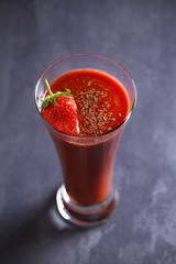 Strawberry smoothie with berry and chocolate. Healthy drink   on gray background