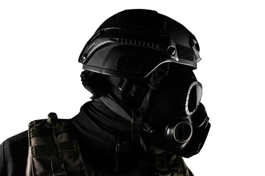 Isolated warrior soldier in gas mask profile view closeup.