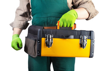 Isolated worker in green overall outfit with toolbox.