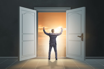Fototapeta premium Businessman entering big large door
