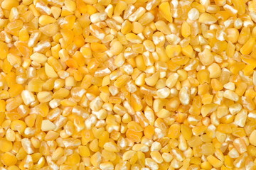 raw crushed corn groats close up