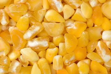 raw crushed corn groats close up