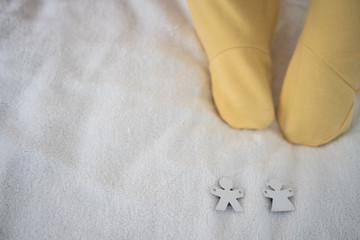 Baby Foot in body suit with boy and girl symbol