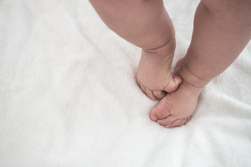 Baby Foot walk step on blanket with copy space
