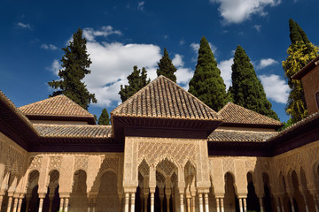 Fototapeta na wymiar Ornate stiled arches in the courtyard of the Lions at Nasrid Palaces Alhambra Granada
