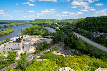 Fototapeta na wymiar Aerial view of a cityscape of Red Wing, Minnesota, as seen from the Barn Bluff overlook hike. Taken in late spring, view of Lake Pepin