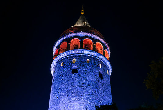View of illuminated Galata Tower at night in Istanbul, Turkey.