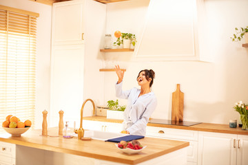 Cute woman doing orange juice.