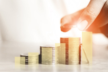 Hand of male putting coins stack step growing growth value, Concept save money financial business...