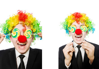 Clown with lollipop isolated on white