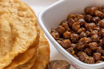 Kala Channa with Puri, Indian dish Or Black Chickpeas with fried bread. Selective focus.