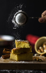 Sprinkling Sugar On Cake Bars