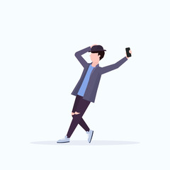 man in hat taking selfie photo on smartphone camera casual male cartoon character posing white background flat full length