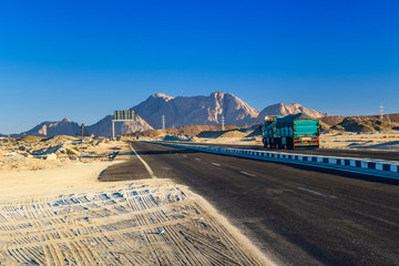 Truck on a road in arabian desert not far from Hurghada city, Egypt